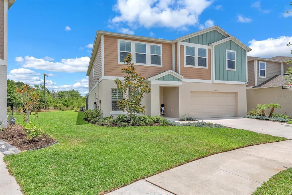 12952 Wellspring Drive Lithia, FL 33547 - Photo 41 of 46 a front view of a house with a yard