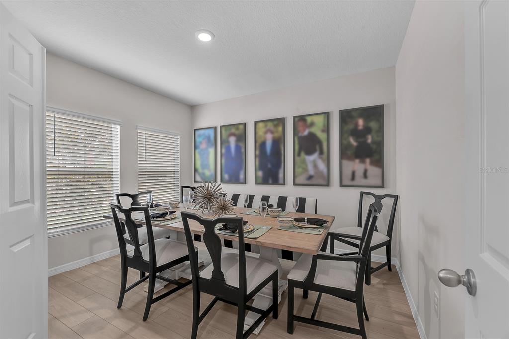 12952 Wellspring Drive Lithia, FL 33547 - Photo 5 of 46 a view of a dining room with furniture and window