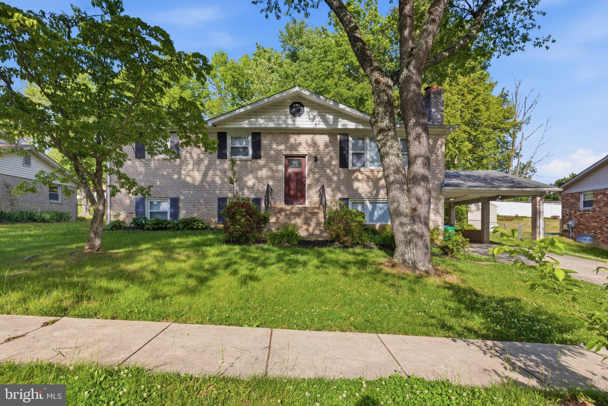 12908 Glynis Road Clinton, MD 20735 - Photo 1 of 32 a front view of a house with a yard