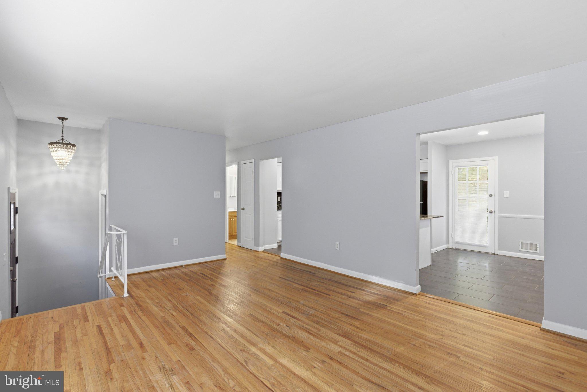 12908 Glynis Road Clinton, MD 20735 - Photo 5 of 32 wooden floor in an empty room with a window