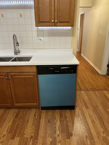 a kitchen with a sink and cabinets