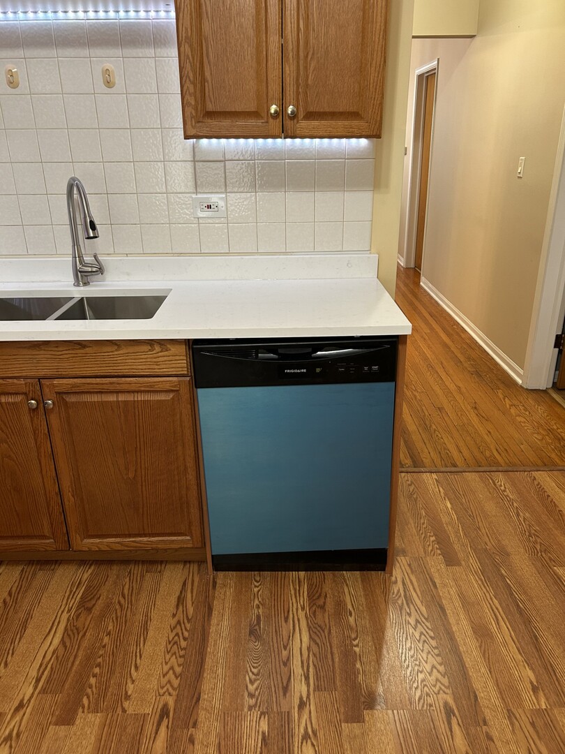 5107 West Cullom Avenue, Unit 2 Chicago, IL 60641 - Photo 14 of 22 a kitchen with a sink and cabinets