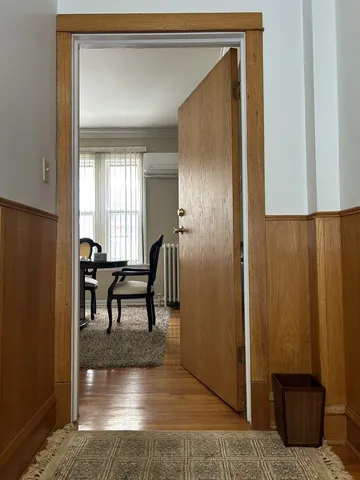 a view of dining room with a table and chairs
