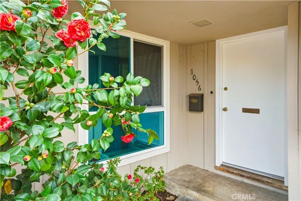 a view of a kitchen with a sink and a refrigerator