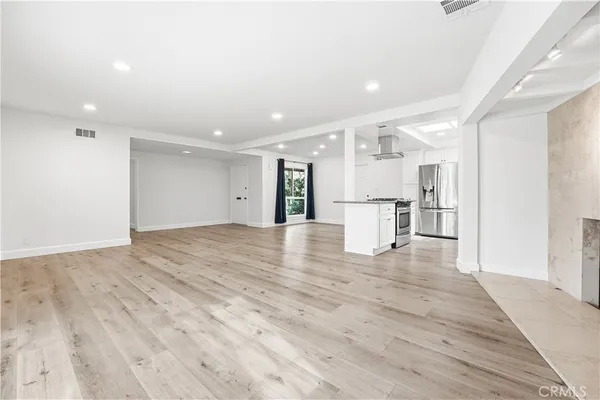 a view of kitchen with wooden floor