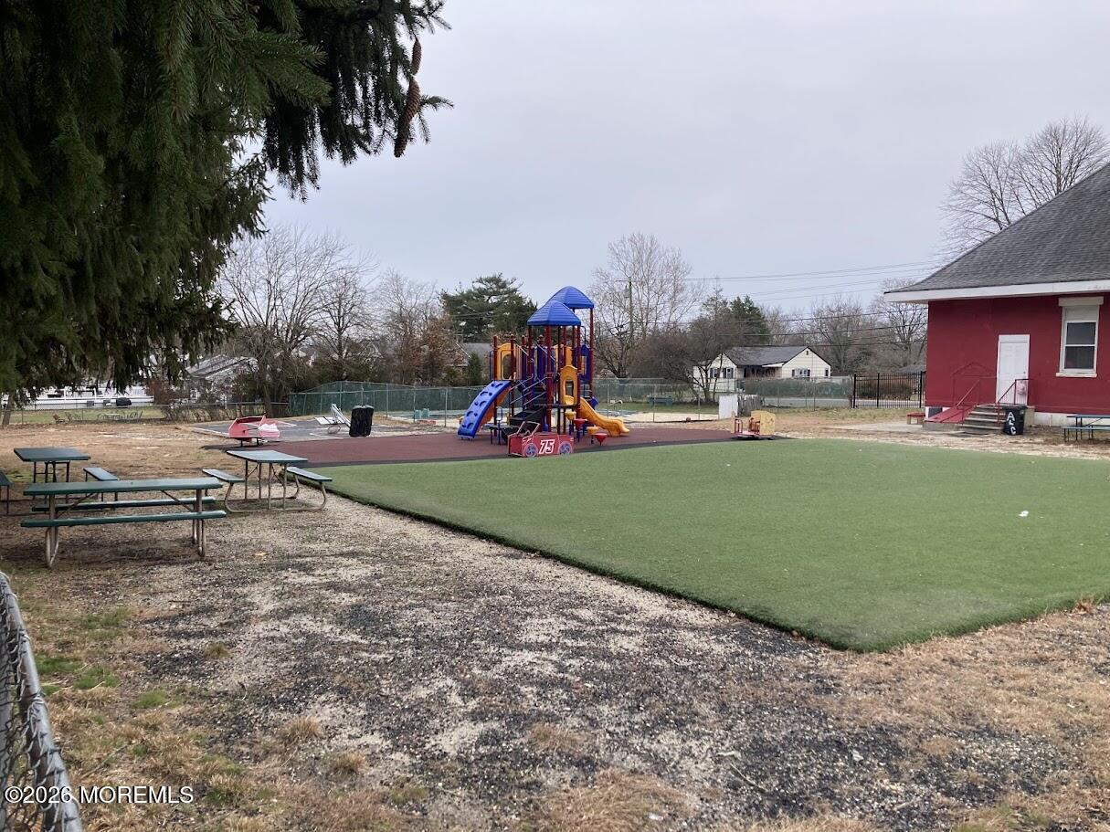 640 Green Grove Road Neptune Township, NJ 07753 - Photo 2 of 9 a view of a park with swings and slides