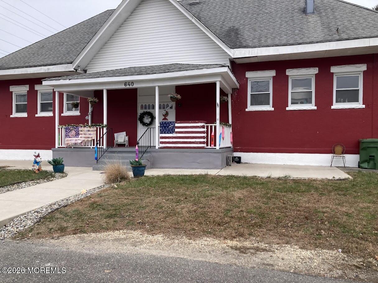 640 Green Grove Road Neptune Township, NJ 07753 - Photo 3 of 9 a front view of a house with garden