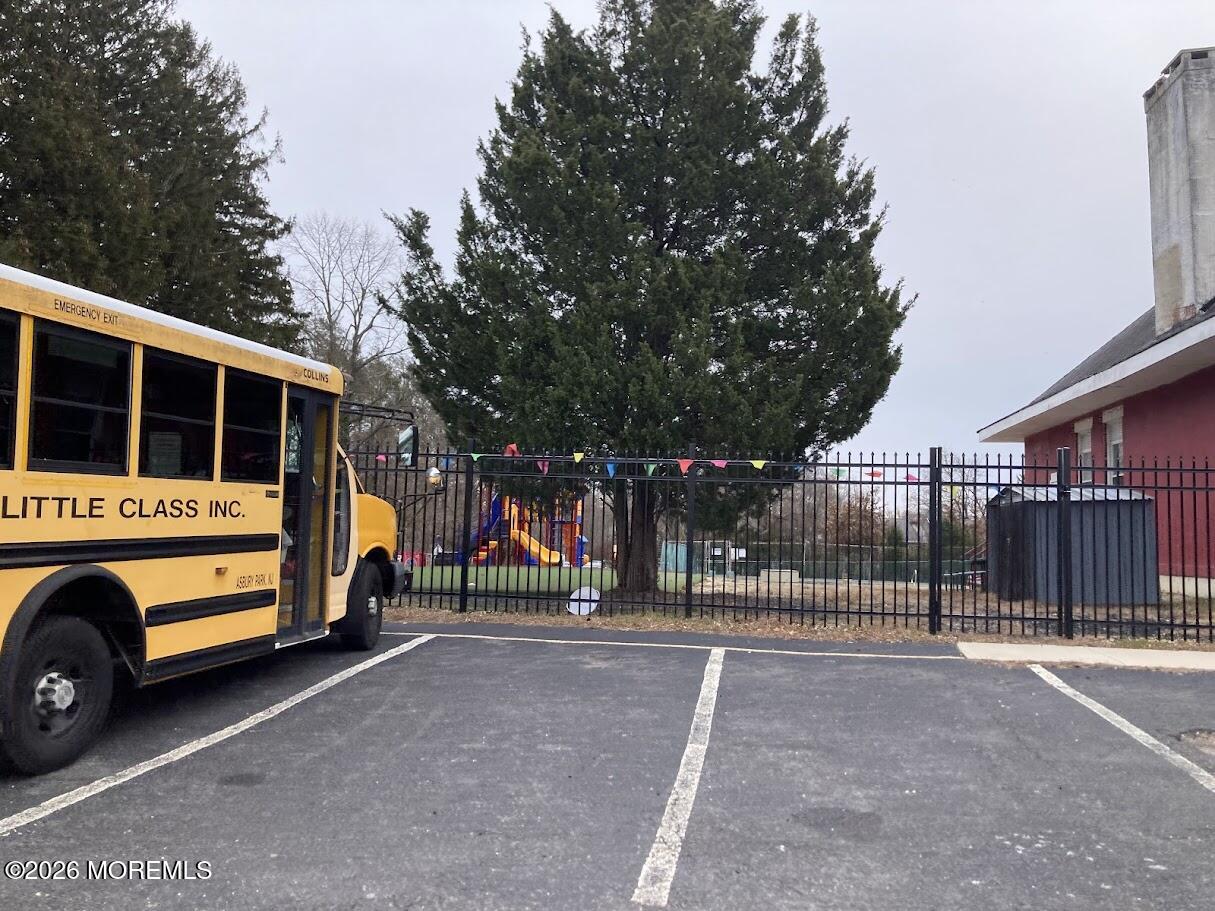 640 Green Grove Road Neptune Township, NJ 07753 - Photo 7 of 9 a view of outdoor space with deck and trees in the background