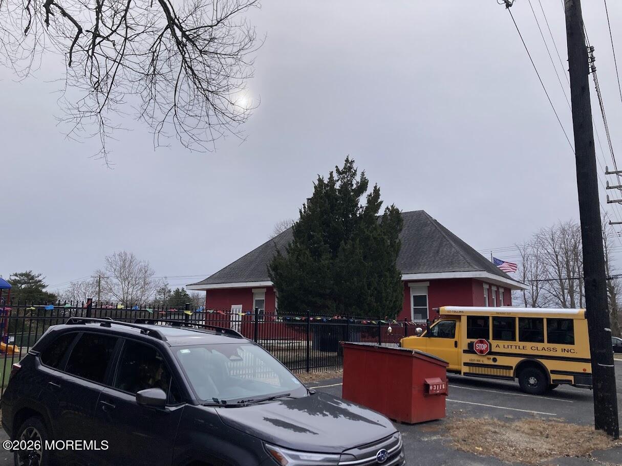 640 Green Grove Road Neptune Township, NJ 07753 - Photo 8 of 9 a front view of residential houses with cars parked