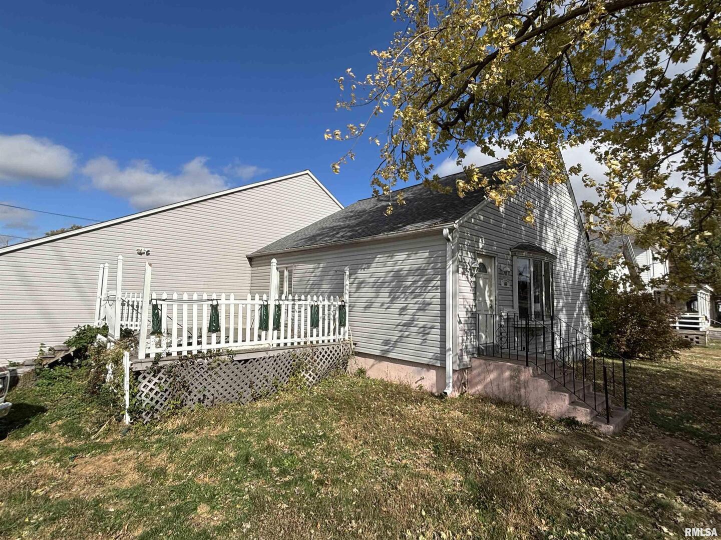 a view of a house with a large tree
