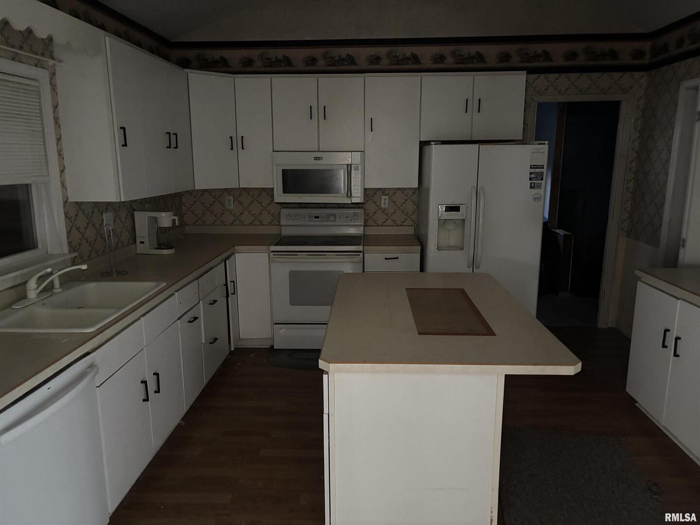 560 South 4th Street Clinton, IA 52732 - Photo 9 of 14 a kitchen with stainless steel appliances a sink stove and refrigerator