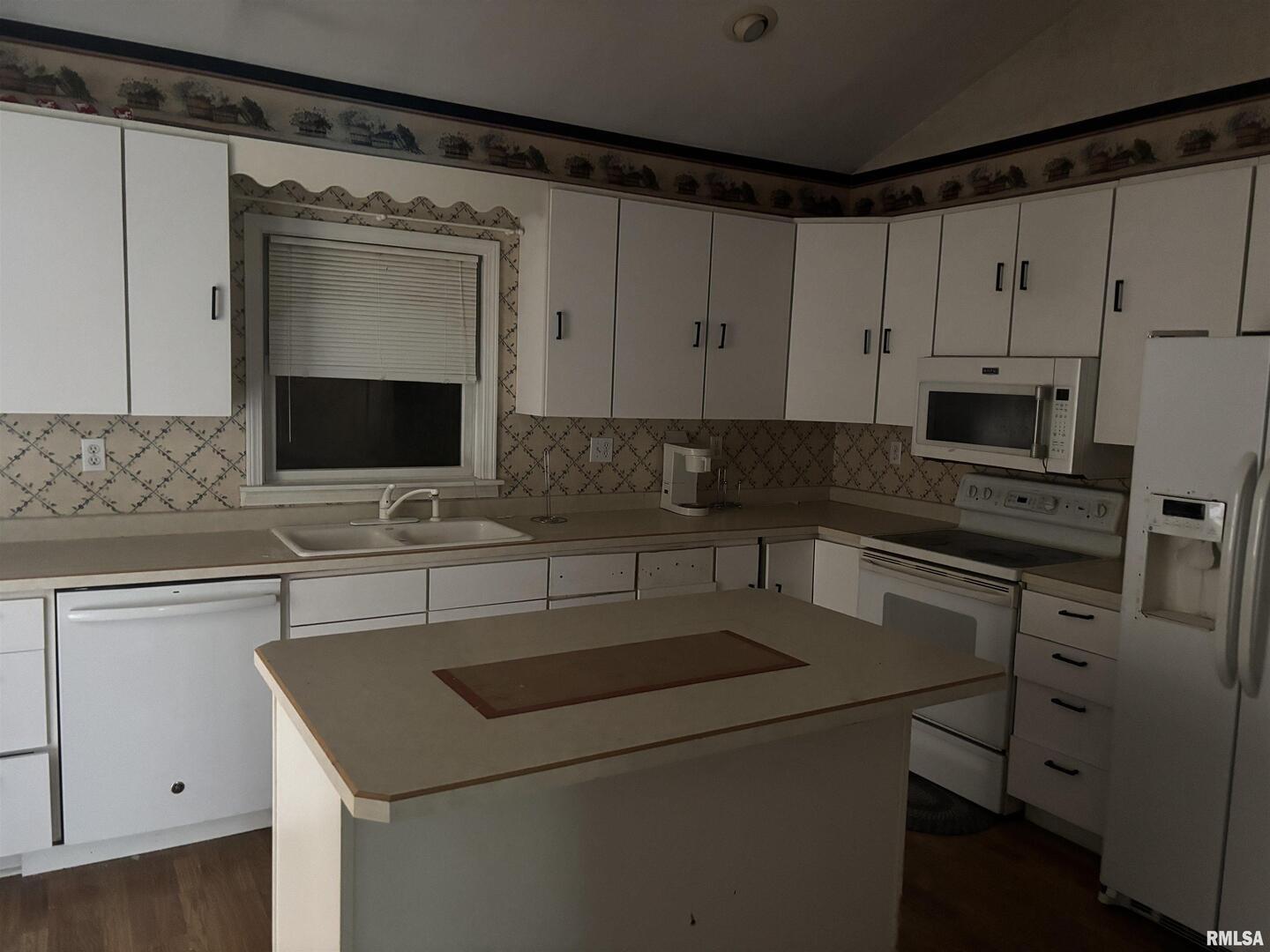 560 South 4th Street Clinton, IA 52732 - Photo 10 of 14 a kitchen with a sink and a microwave