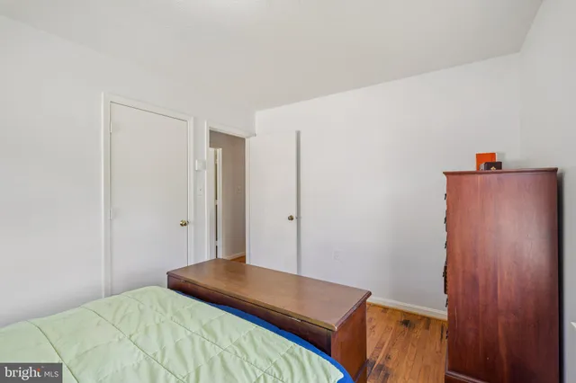 a bedroom with a bed and cabinets