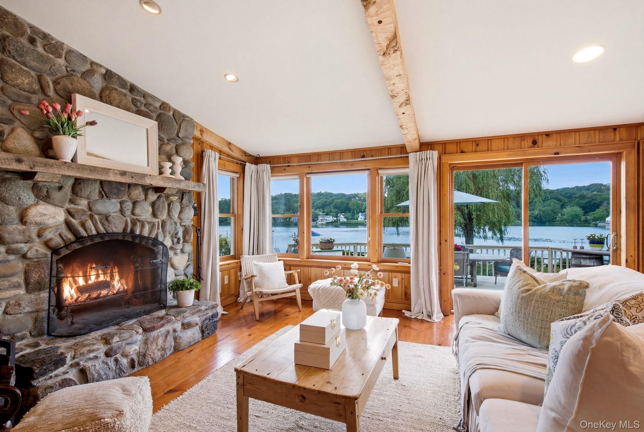 33 Prospect Road Centerport, NY 11721 - Photo 12 of 48 Family Room with second wood burning fireplace, ceiling with wood beams and paneled walls.