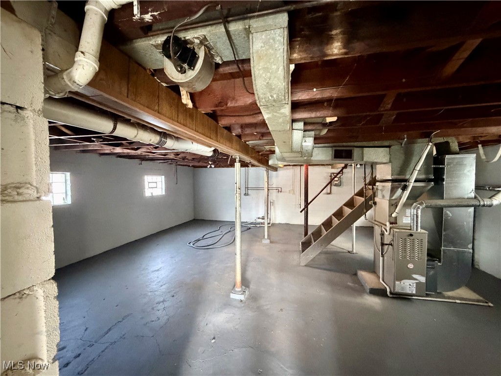 34 West Lewis Street Struthers, OH 44471 - Photo 12 of 14 Basement with heating unit and stairs