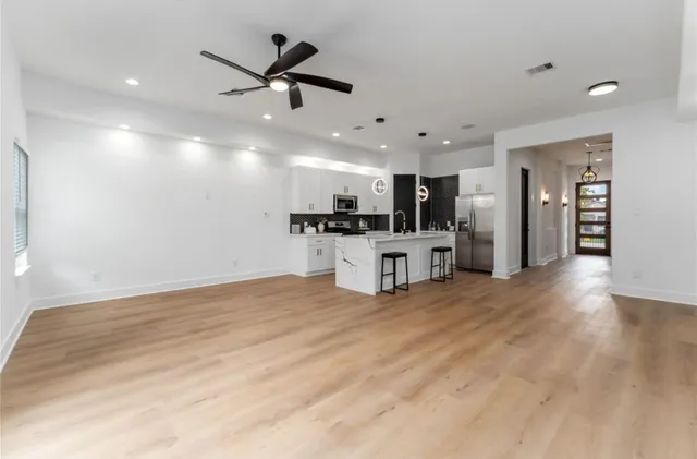 a view of a kitchen with a sink and microwave