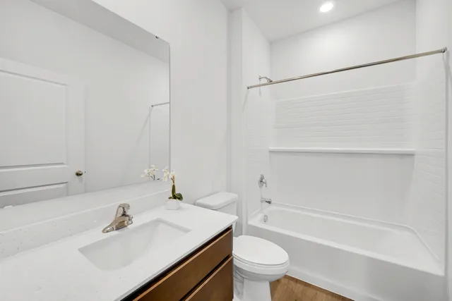 a bathroom with a sink toilet and a bathtub