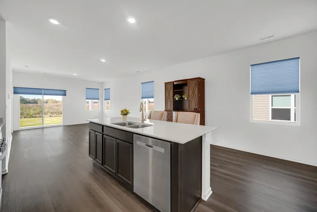 a view of a kitchen counter space and wooden floor