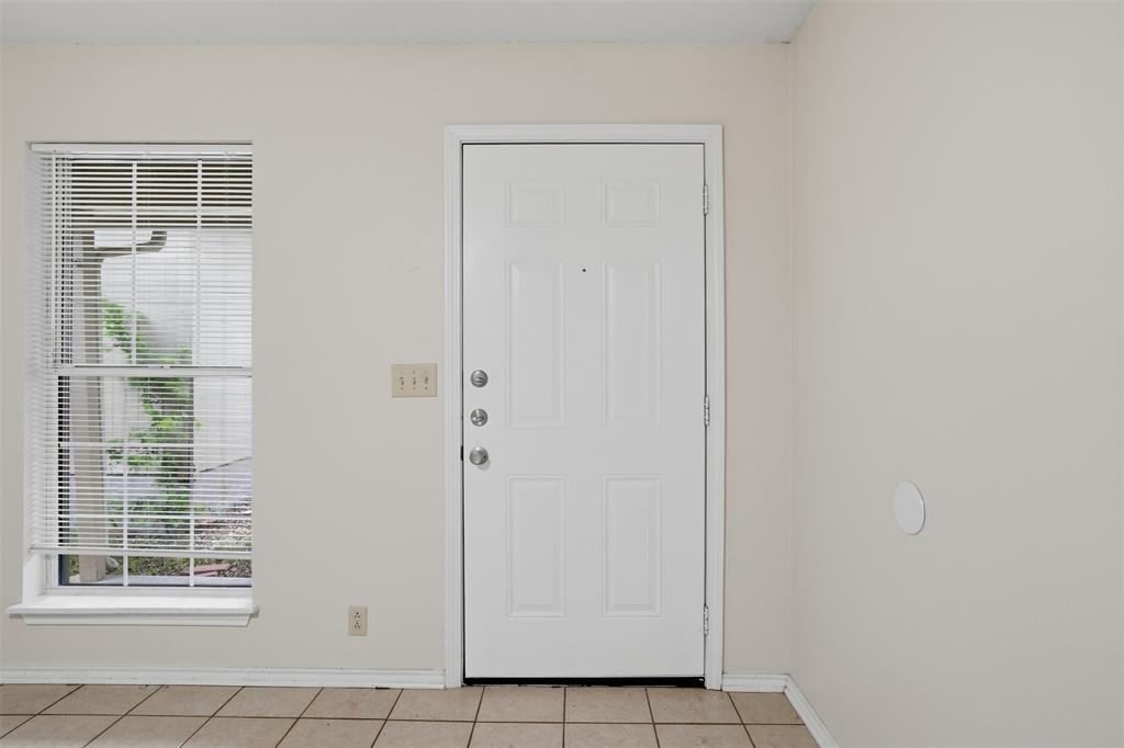 106 Shaw Street, Unit 106 Tom Bean, TX 75491 - Photo 2 of 25 a view of an empty room with windows