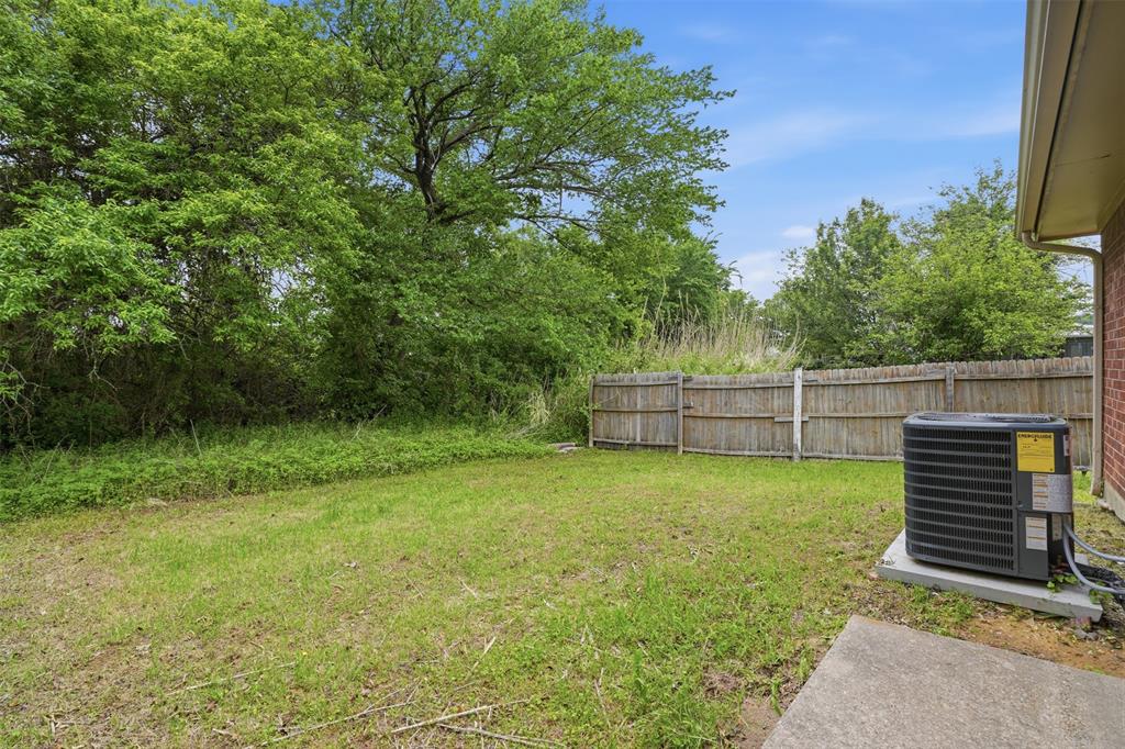 106 Shaw Street, Unit 106 Tom Bean, TX 75491 - Photo 22 of 25 a view of a backyard