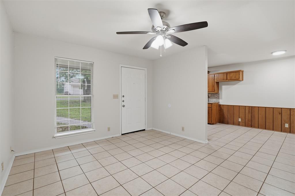 106 Shaw Street, Unit 106 Tom Bean, TX 75491 - Photo 4 of 25 a view of an empty room and window
