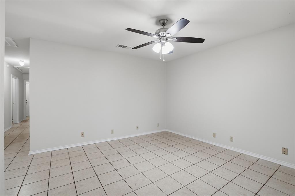 106 Shaw Street, Unit 106 Tom Bean, TX 75491 - Photo 10 of 25 a view of an empty room and window