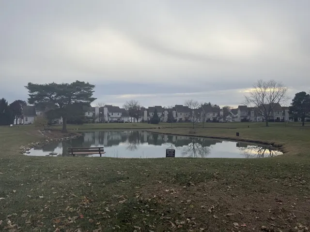 a view of a lake with houses in the back