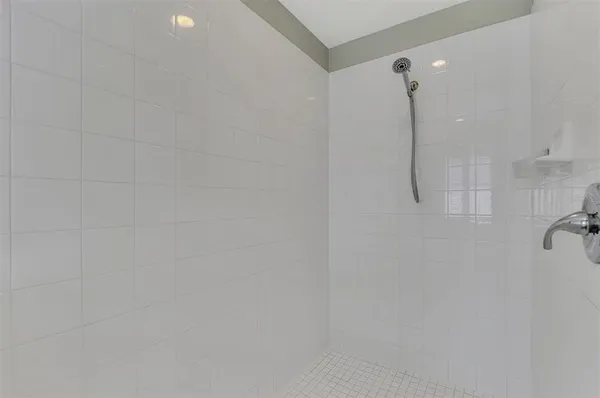 a bathroom with double sink and a mirror