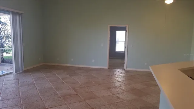 a view of an empty room and window