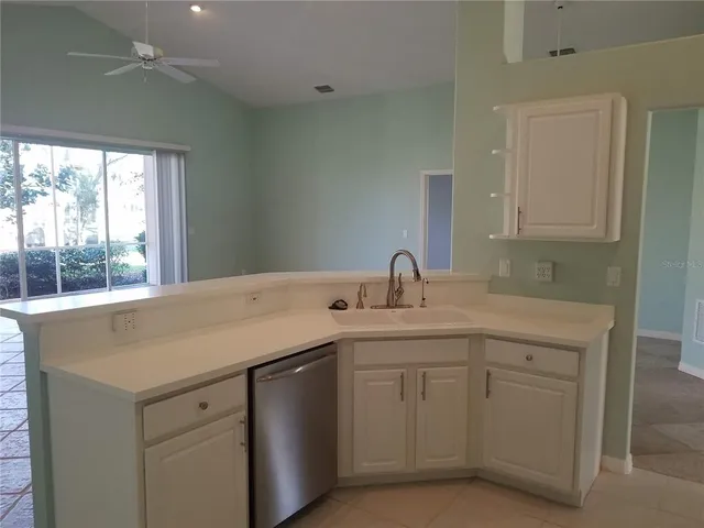 a kitchen with a sink and cabinets