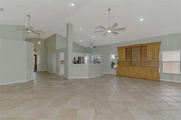 a view of a kitchen with cabinet and a ceiling fan