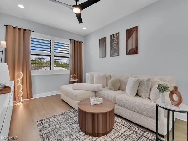 a living room with furniture and a rug