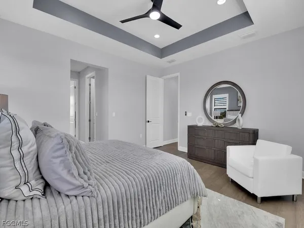 a bedroom with a bed and a dresser