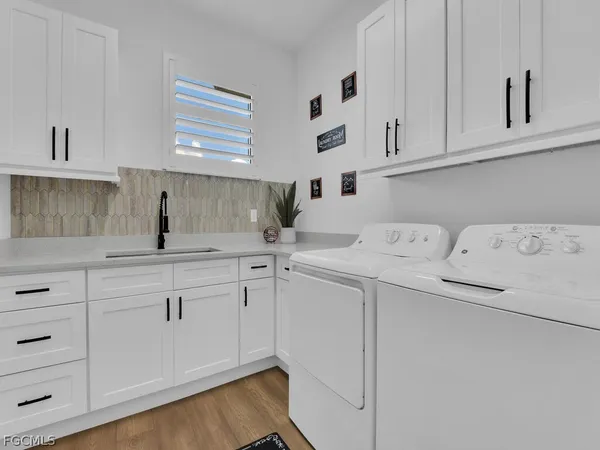 a kitchen with sink and cabinets