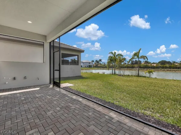 a view of a house with a yard and a large pool
