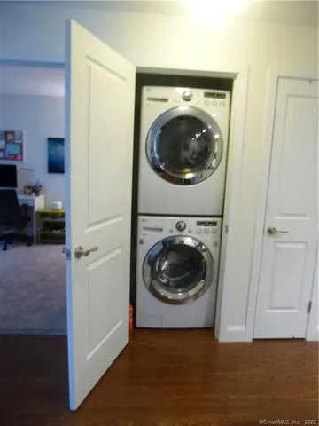 a view of a hallway with washer and dryer