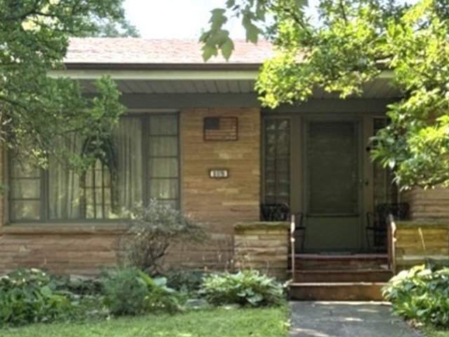 809 West Delaware Avenue Urbana, IL 61801 - Photo 1 of 10 a front view of a house with a garden