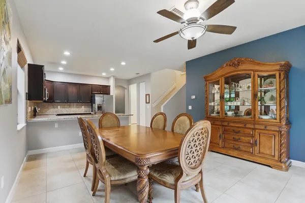 a dining room with furniture and window