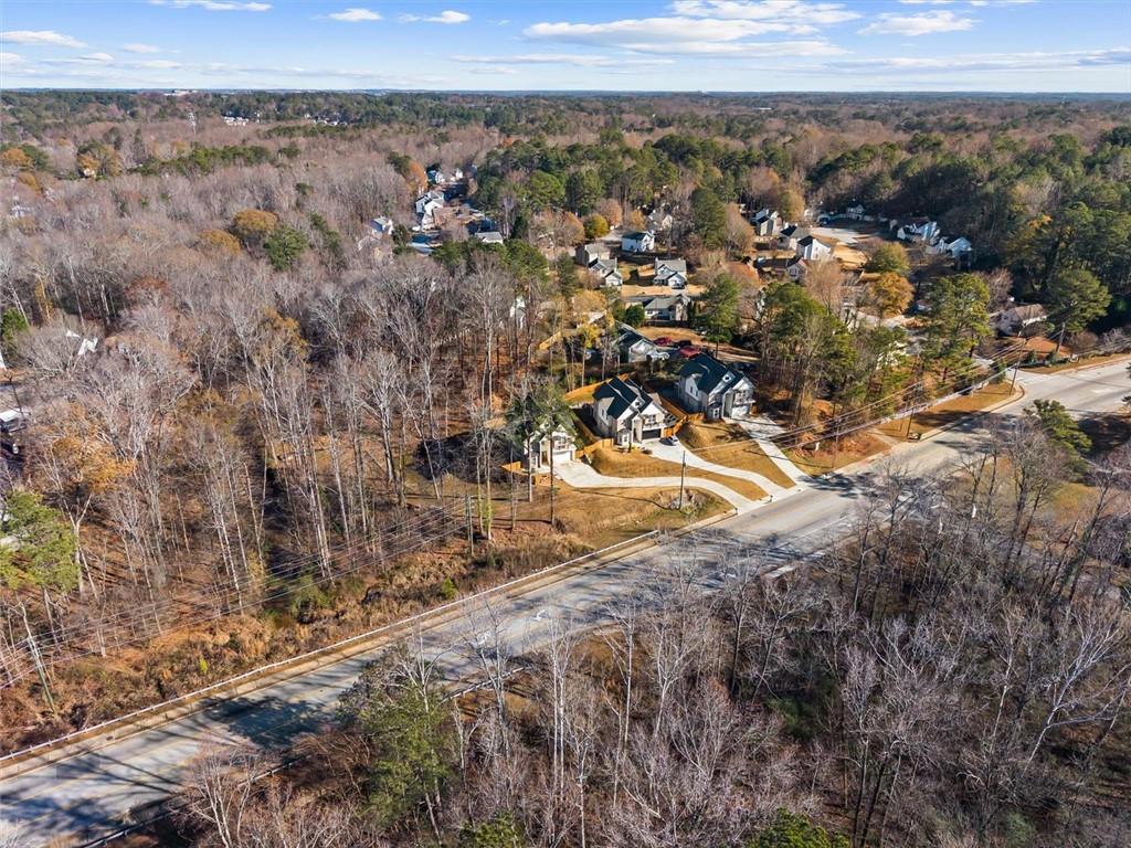 658 Rockbridge Road Northwest Lilburn, GA 30047 - Photo 58 of 61 a view of a dry yard with trees