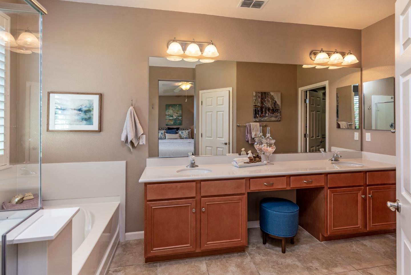5602 Mesa Road Gilroy, CA 95020 - Photo 12 of 23 a spacious bathroom with a bathtub double sink and a mirror