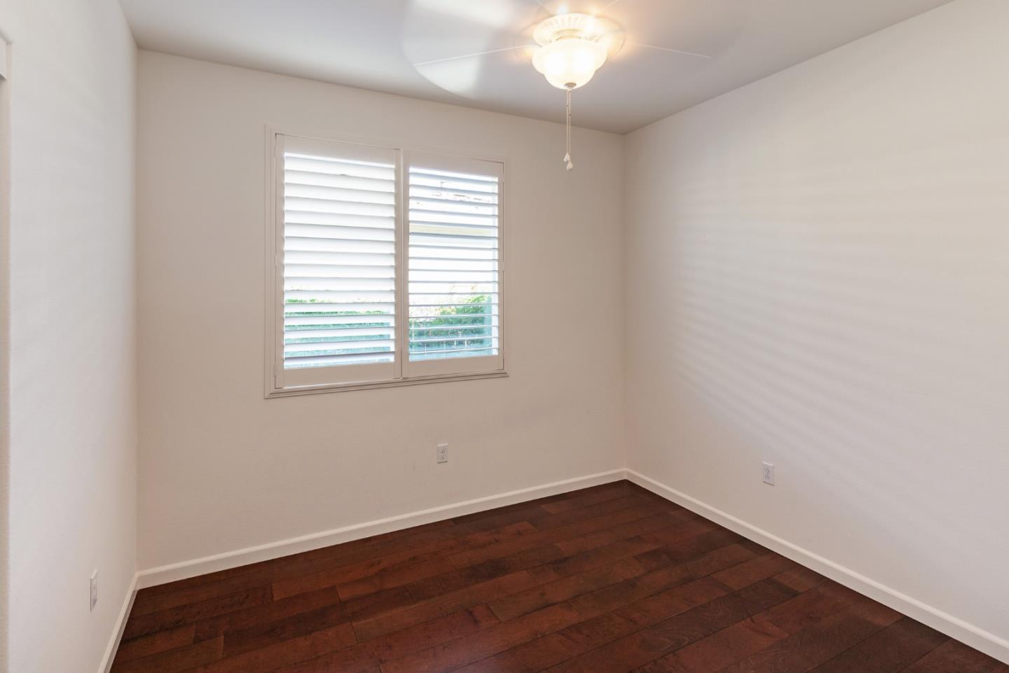 5602 Mesa Road Gilroy, CA 95020 - Photo 15 of 23 an empty room with wooden floor and windows