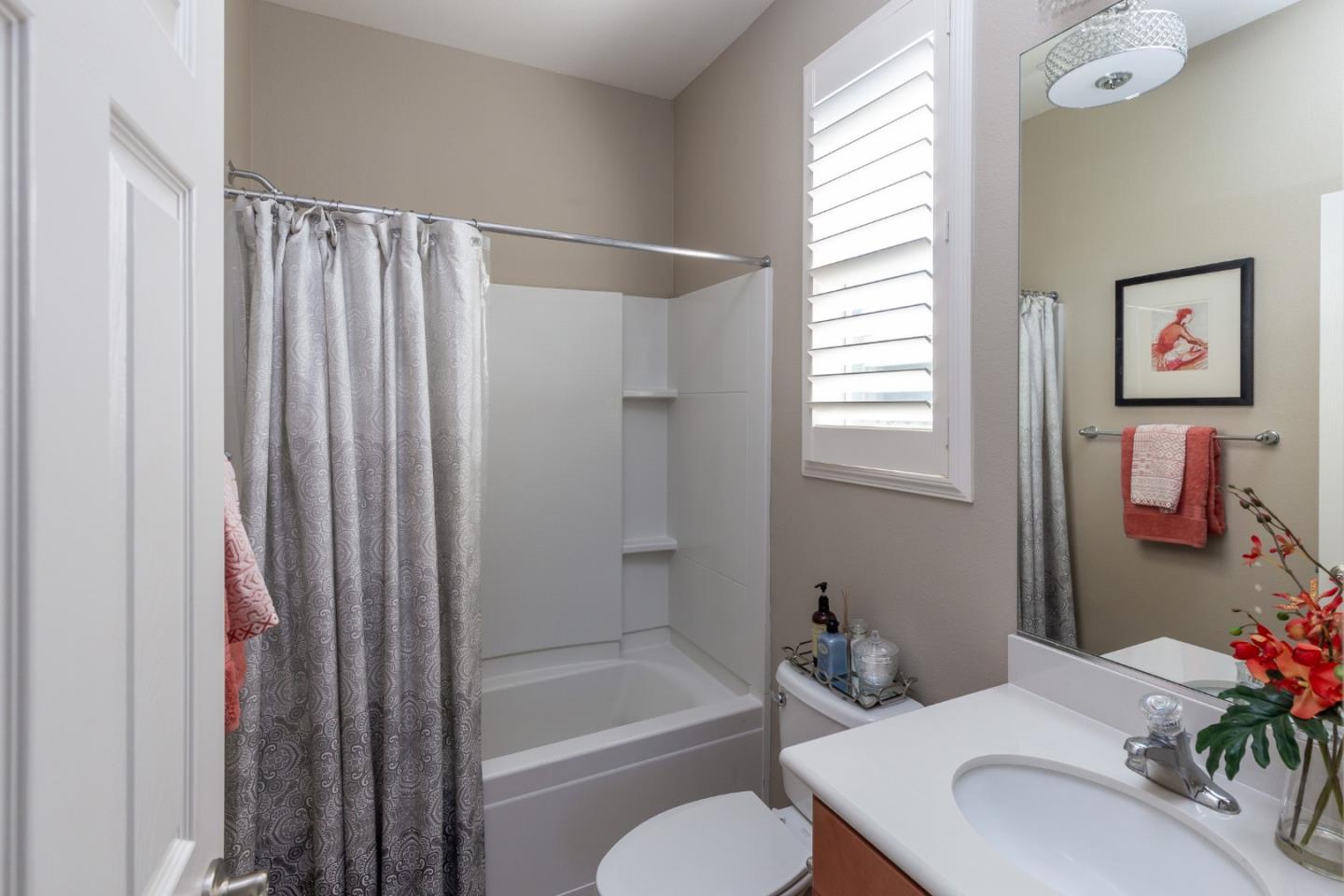 5602 Mesa Road Gilroy, CA 95020 - Photo 18 of 23 a bathroom with a sink toilet and shower