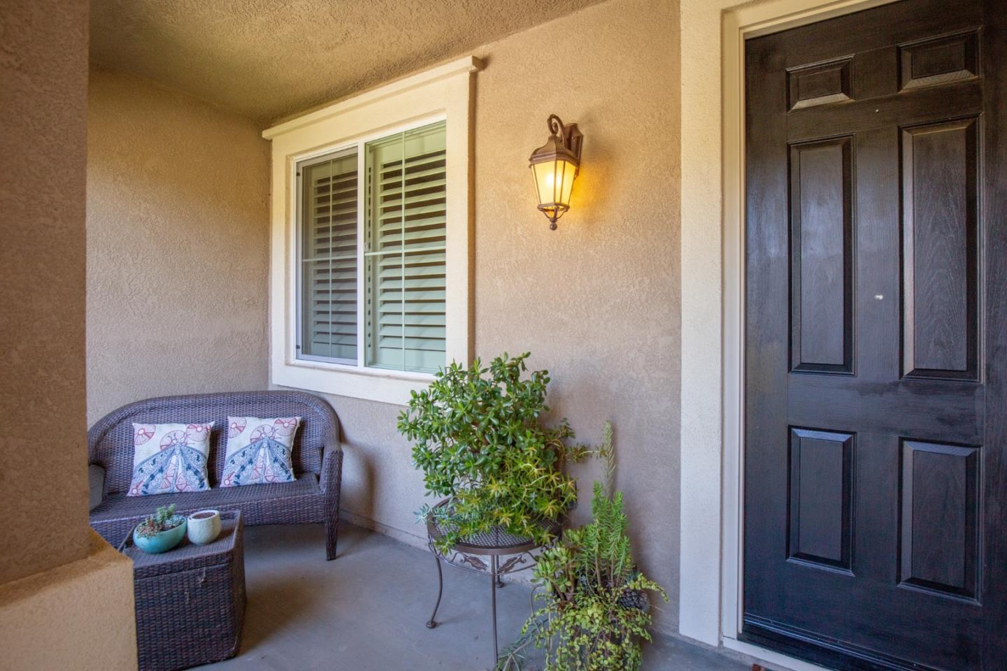5602 Mesa Road Gilroy, CA 95020 - Photo 2 of 23 a front view of a house with outdoor seating and plants