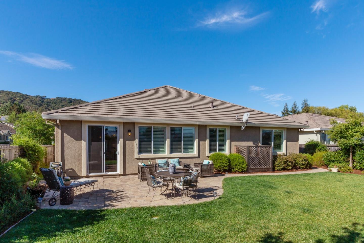 5602 Mesa Road Gilroy, CA 95020 - Photo 22 of 23 a view of a house with backyard sitting area and garden