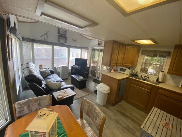 a kitchen with sink refrigerator and outdoor view
