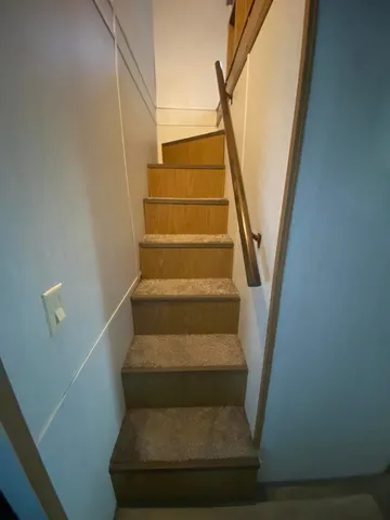 a view of a livingroom with furniture and windows