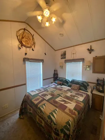 a bedroom with a bed and cabinets