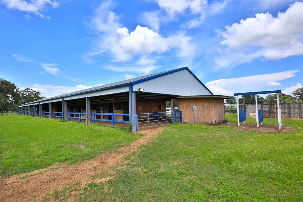 12219 Southwest 26th Street Ocala, FL 34481 - Photo 30 of 63 a view of a house with a yard and sitting area