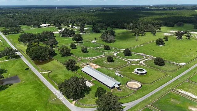 a view of a swimming pool and fire pit