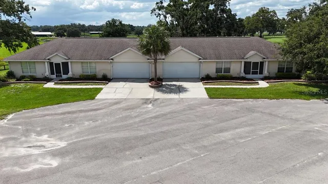 an aerial view of a house with outdoor space